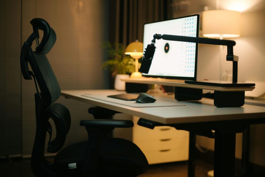 Ergonomic home office desk setup with monitor and accessories
