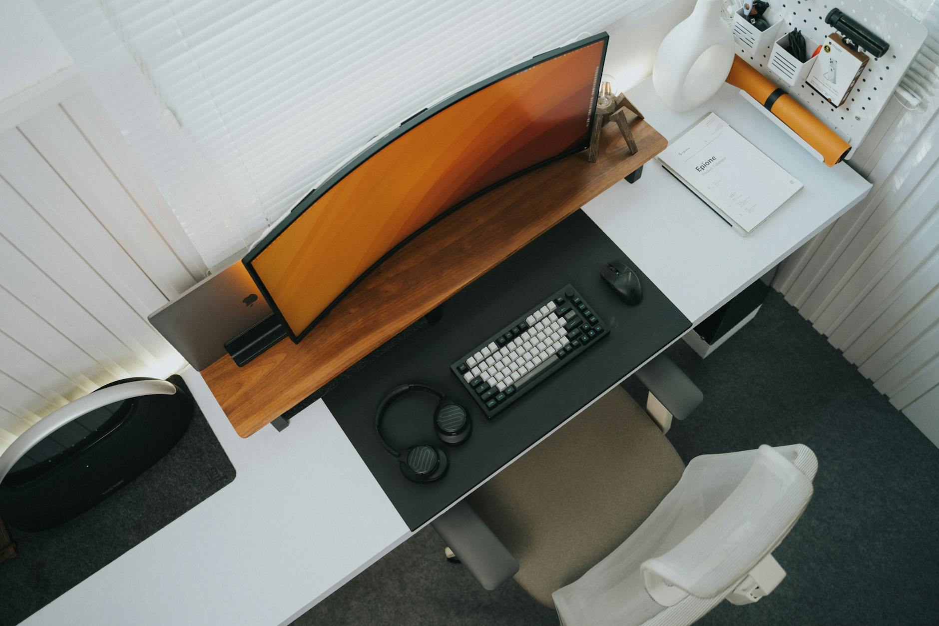 Clean standing desk setup viewed from above with organised cables and accessories