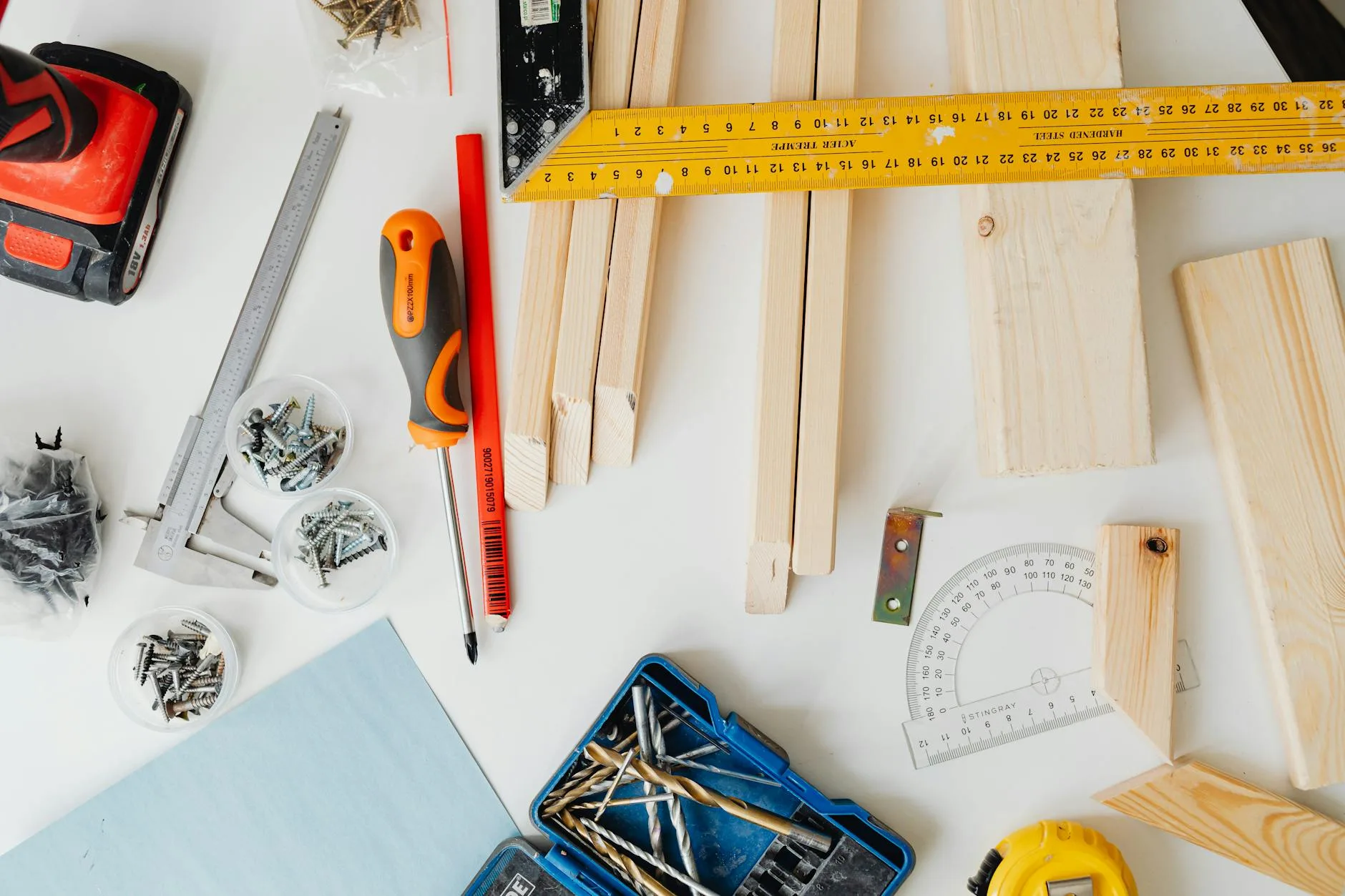 Wooden desk frame partially assembled with tools showing construction process