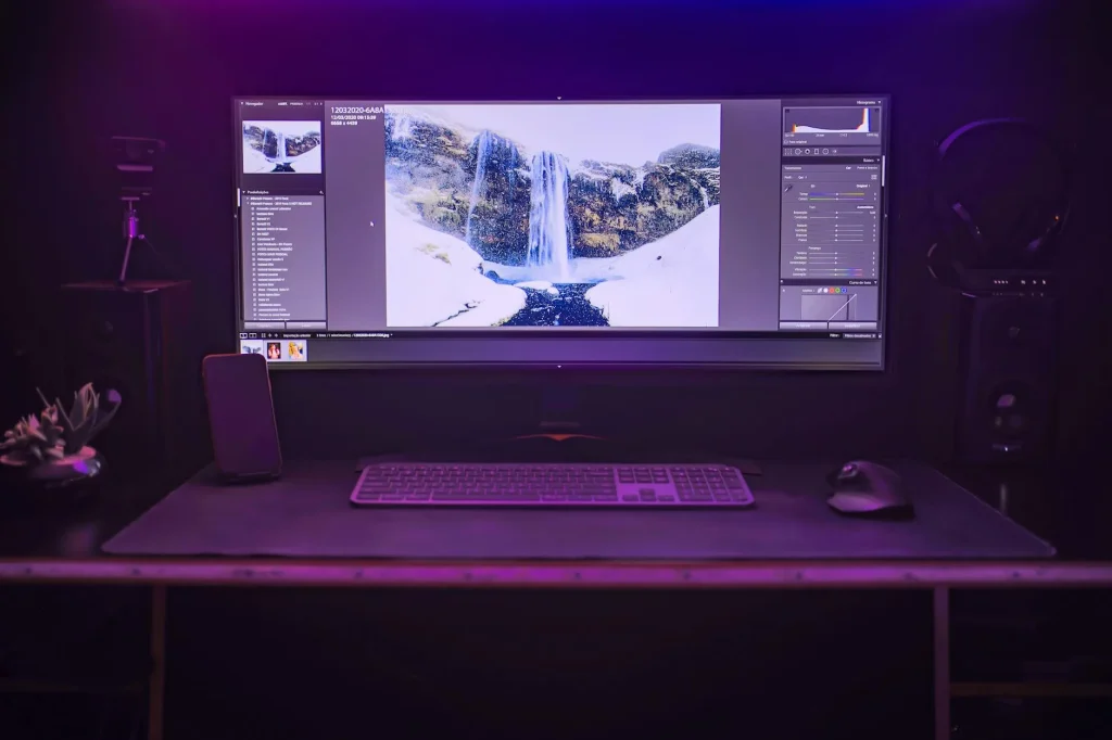 Computer monitor with colourful display on a clean desk workspace