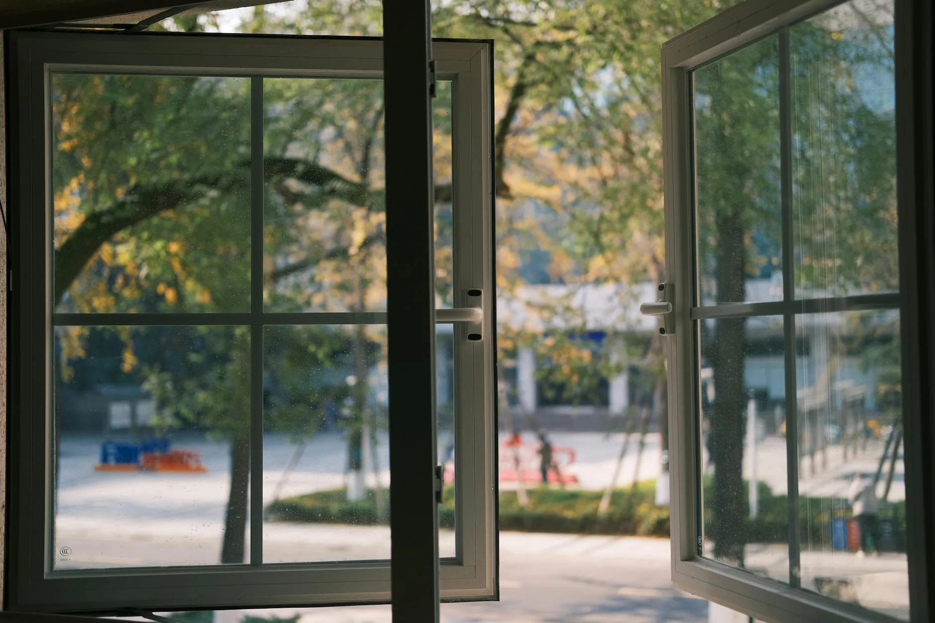 Open window allowing breeze for cross-ventilation