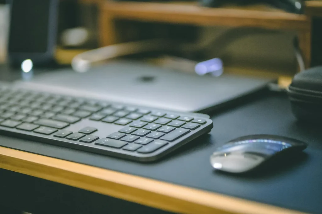 Large desk mat with keyboard and mouse on a clean workspace