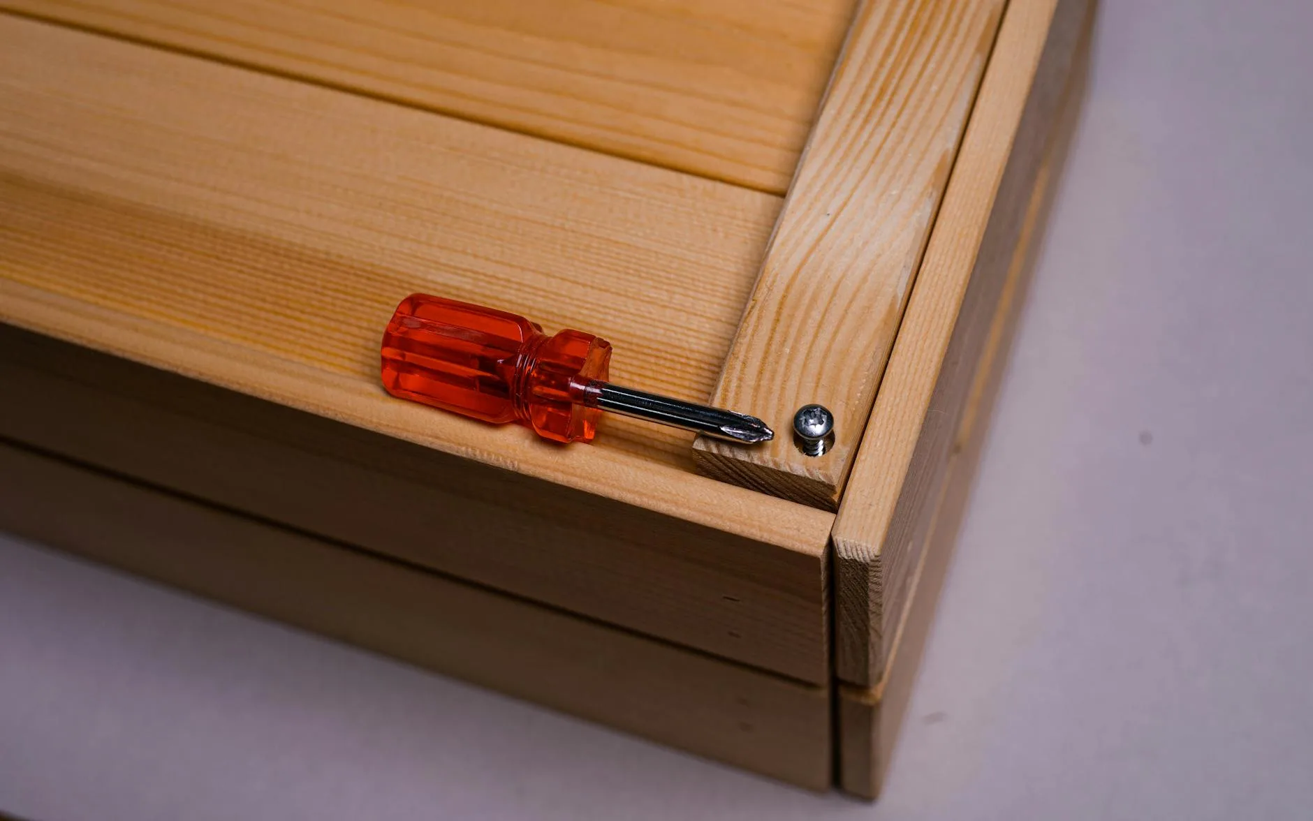 Flat-pack desk being assembled with tools