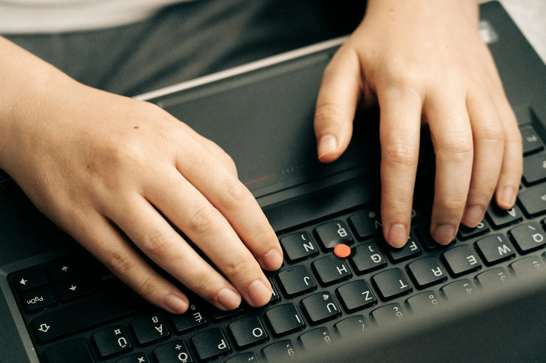 Person typing showing correct wrist position at keyboard