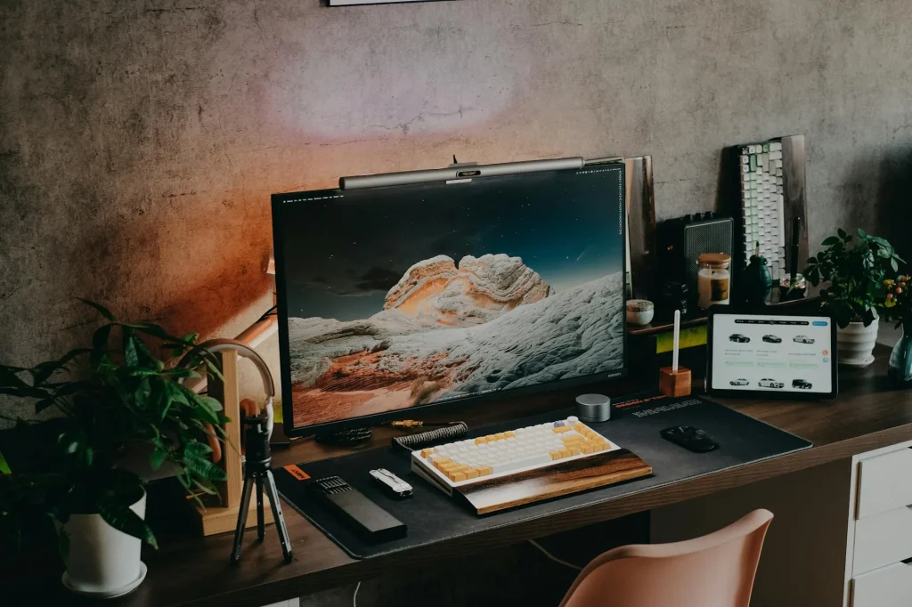Clean modern home office desk setup with monitor and keyboard