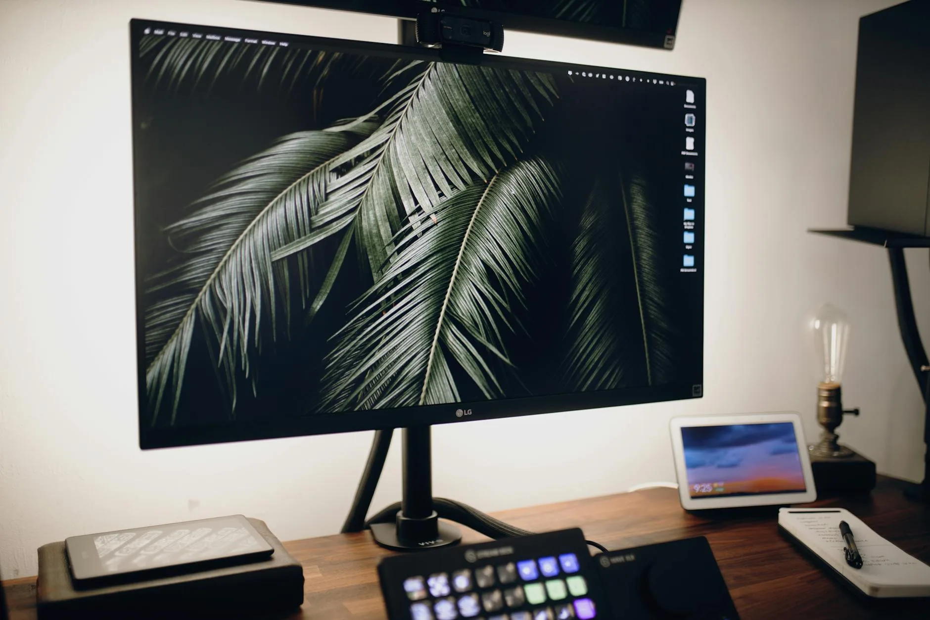 Bright desktop monitor on a home office desk in daylight for brightness calibration