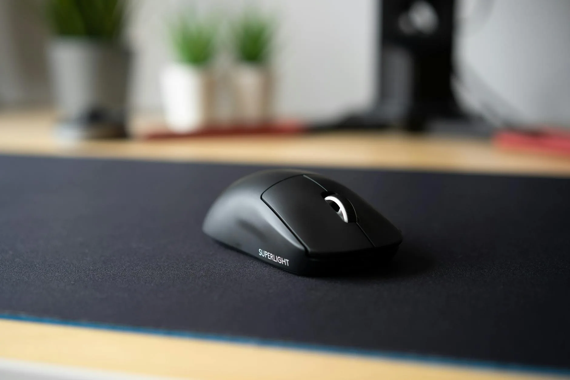 Small mouse pad on a desk next to a keyboard
