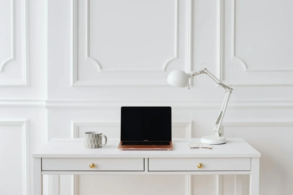 Minimalist home office desk setup in a small rental room