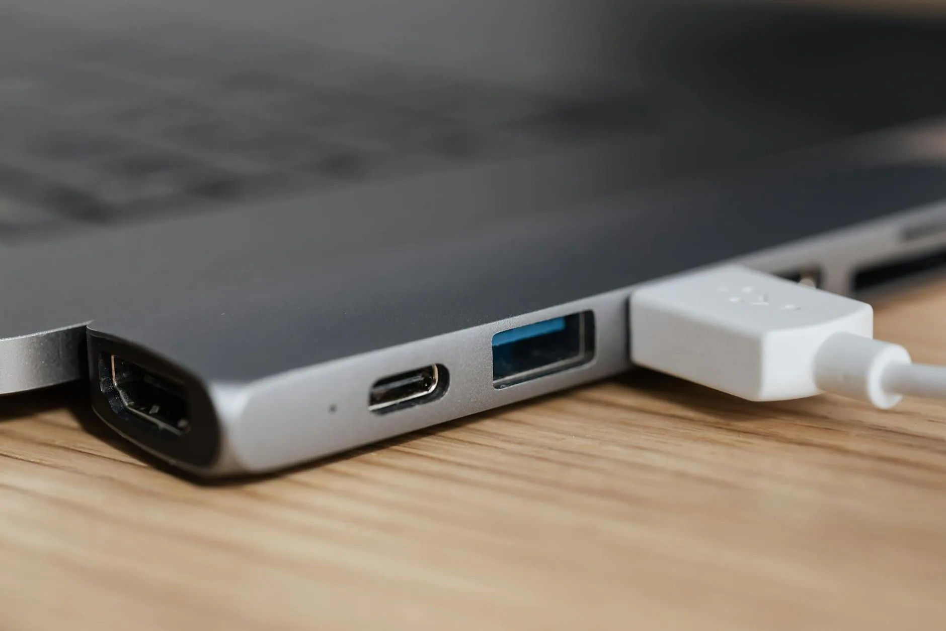 Close up of USB-C and Thunderbolt ports on the side of a modern laptop
