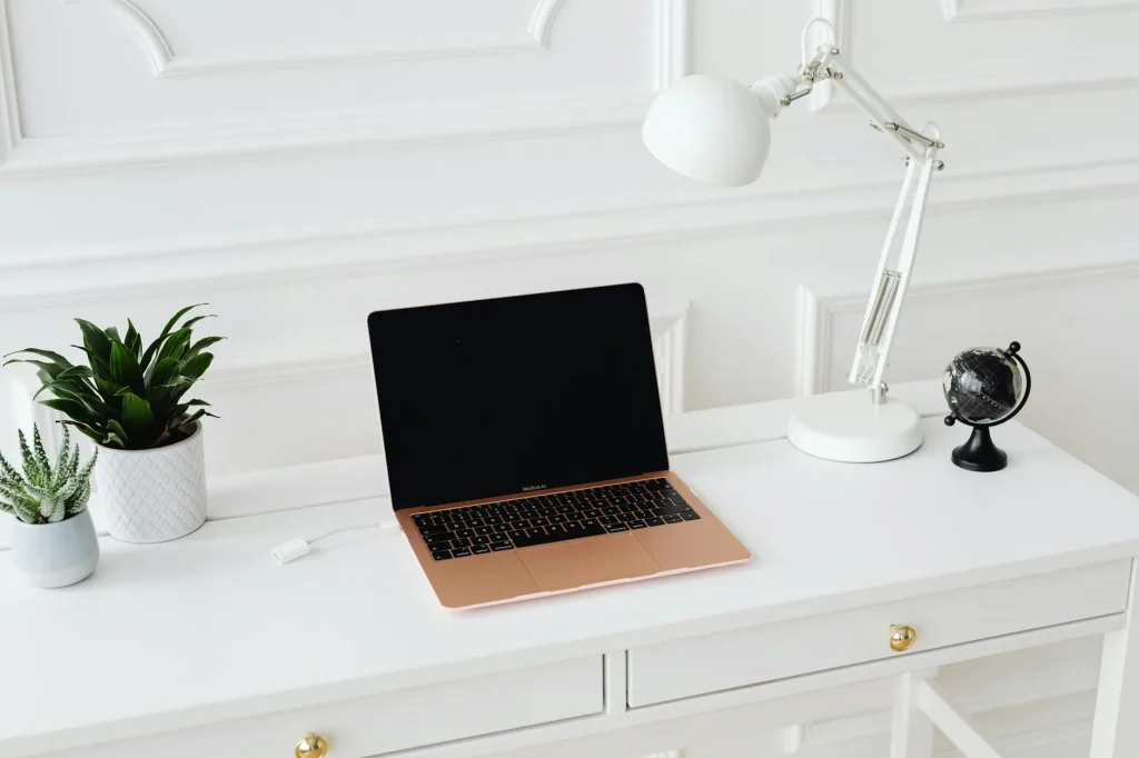 Clean white desk in a minimalist home office setup