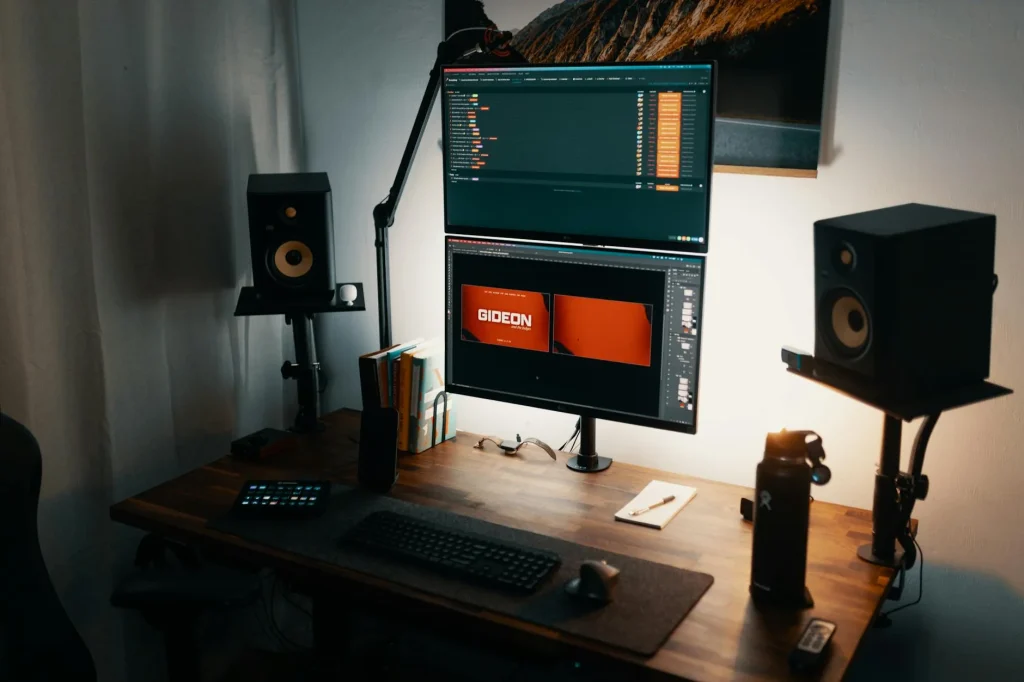 Dual monitors on desk showing high resolution display