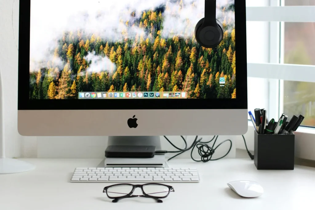 Clean organized desk workspace with monitor and accessories