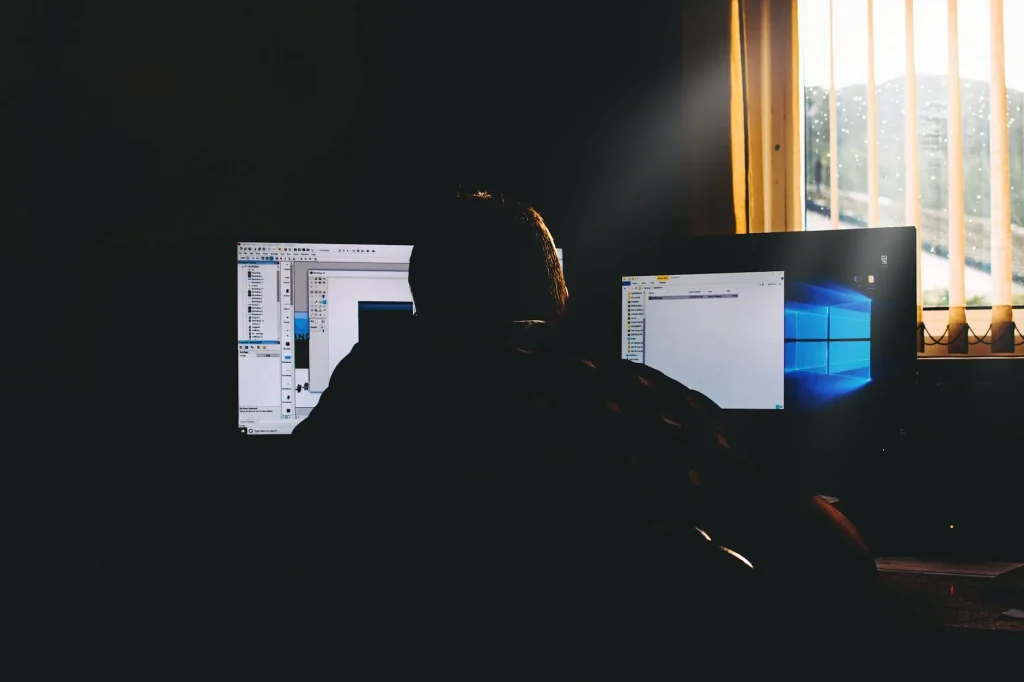 Computer monitor on desk with sunlight causing glare