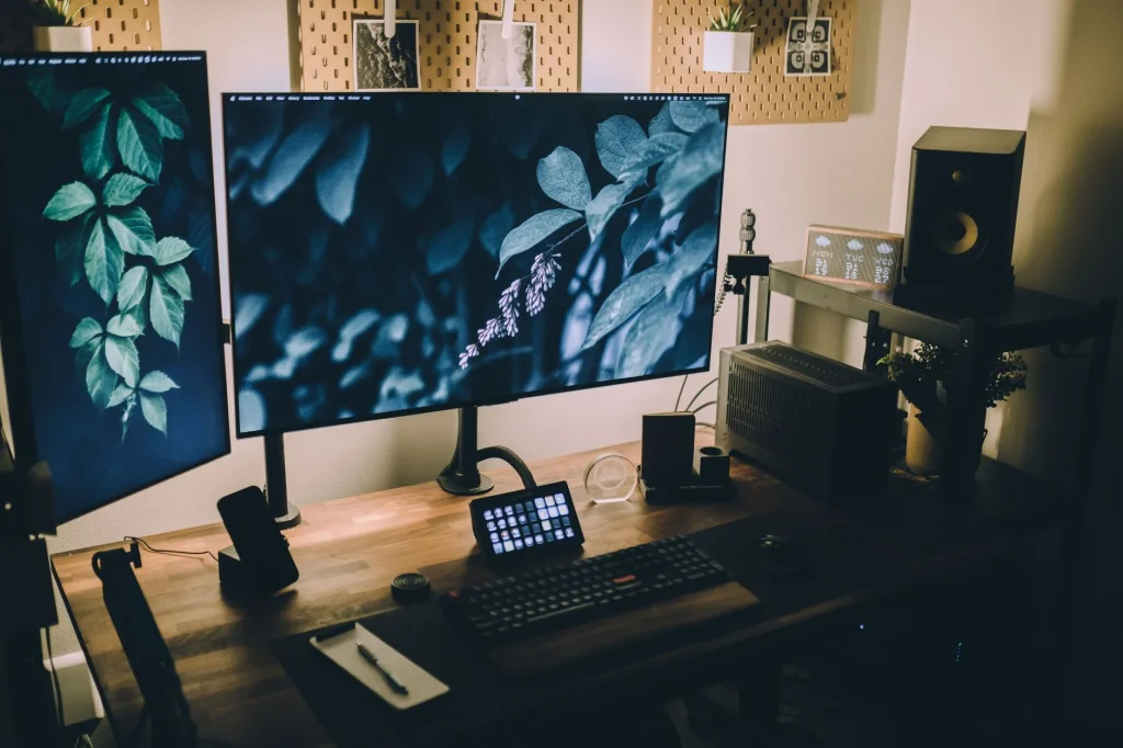 Home office desk with a large monitor for choosing the right screen size