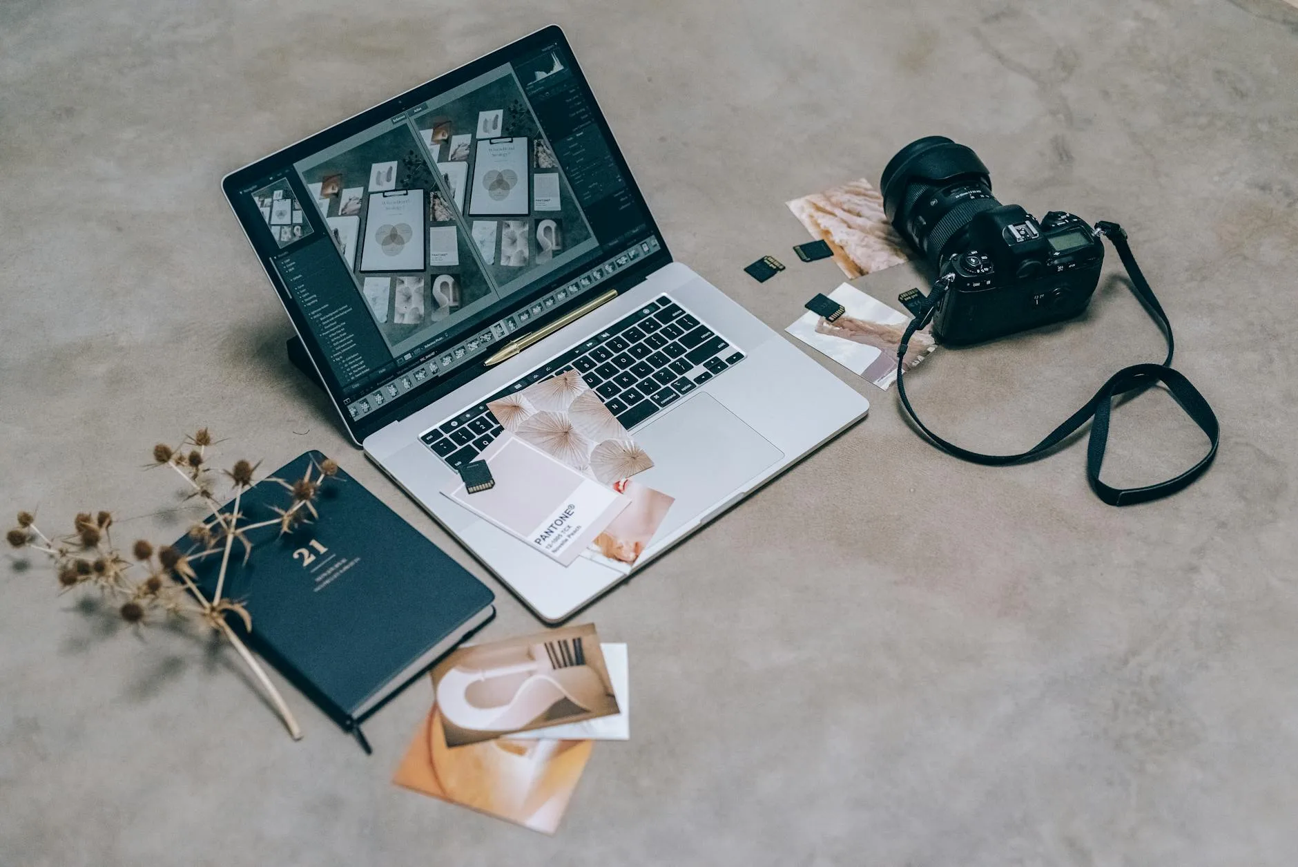 Photographer editing photos on a large desktop monitor