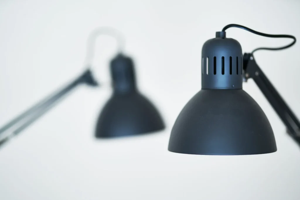 Adjustable desk lamp lighting a home office workspace