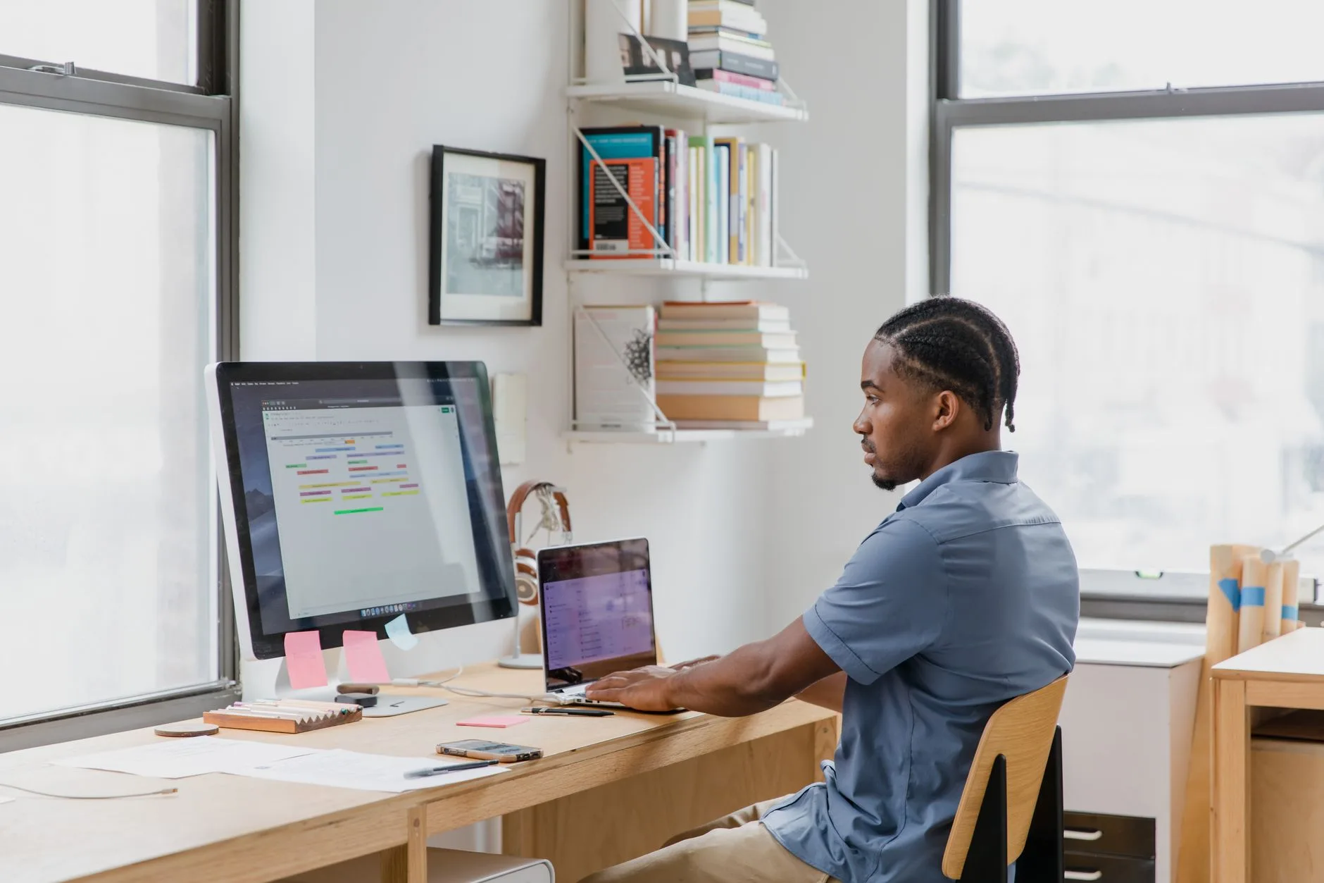 Laptop dock connected to dual monitors in a home office setup