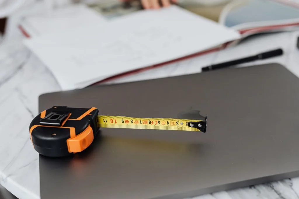 Tape measure across a home office space for a new desk
