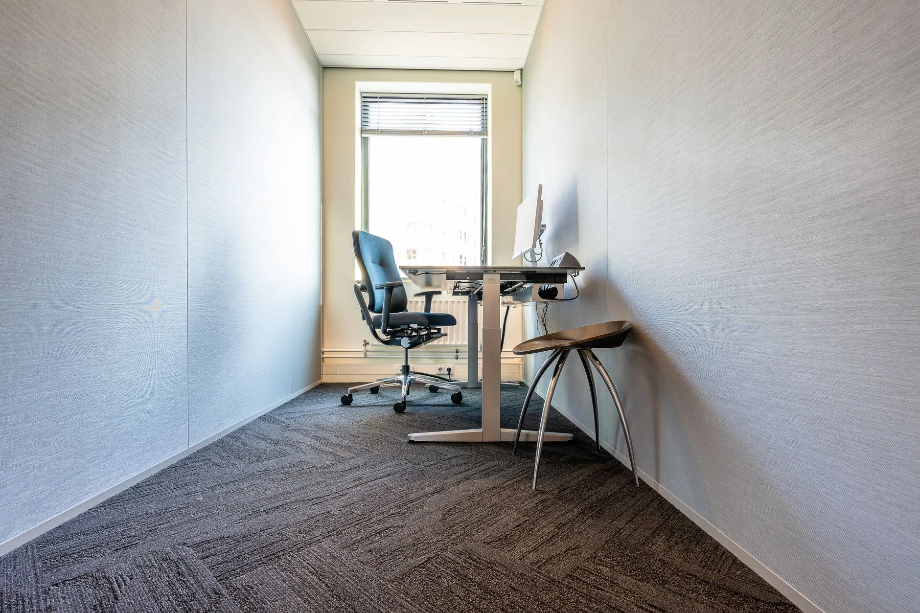 Compact home office desk with clear space for chair and cables