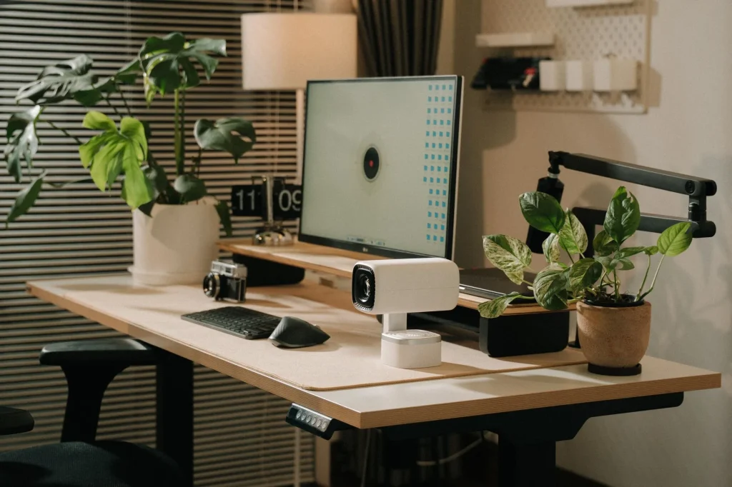 Electric standing desk in a tidy UK home office
