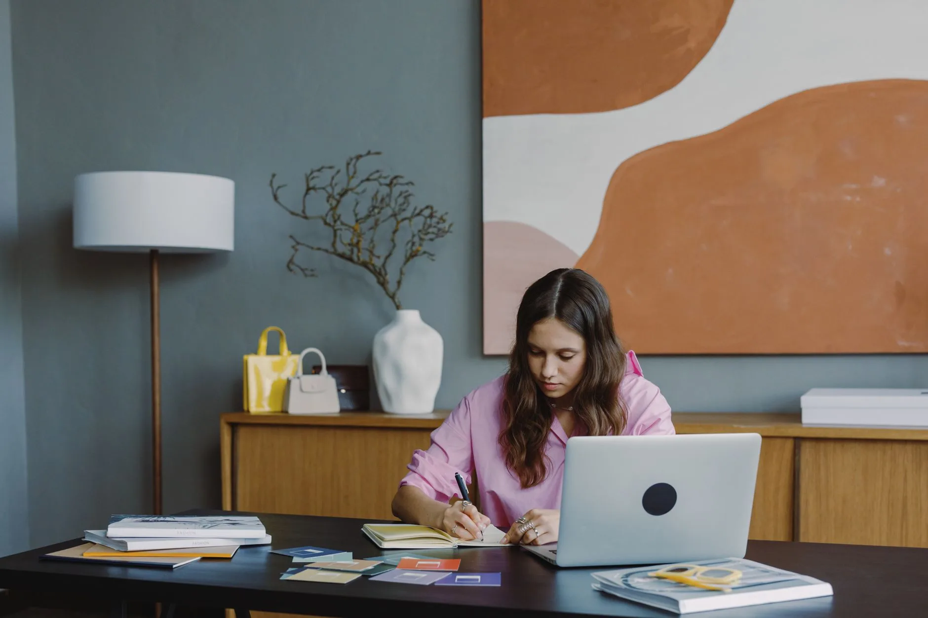 Writing desk surface with laptop notebook and lamp for authors