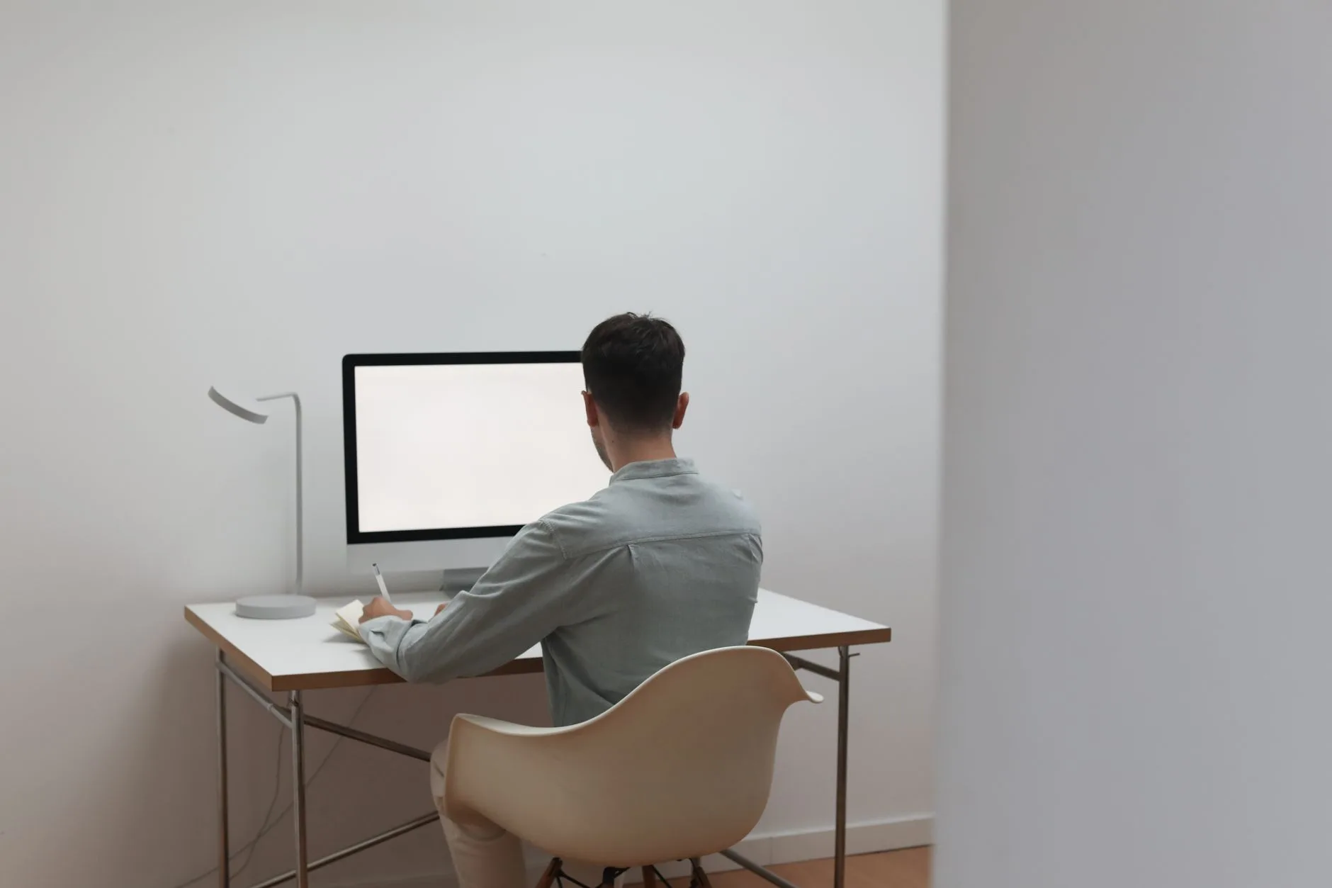 Warm task lighting across a home office desk